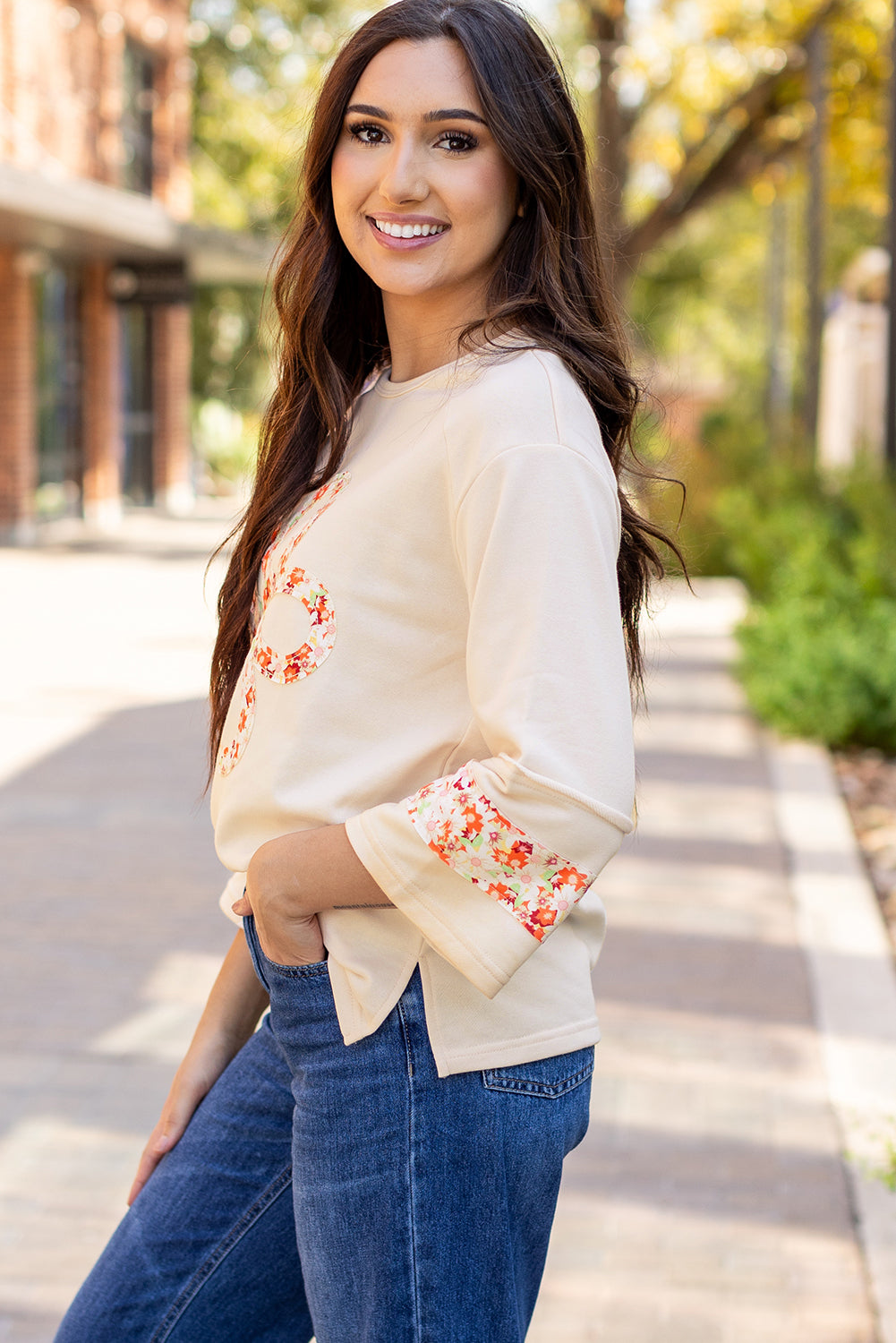 Flower Patch Graphic Exposed Seam Wide Sleeve Top